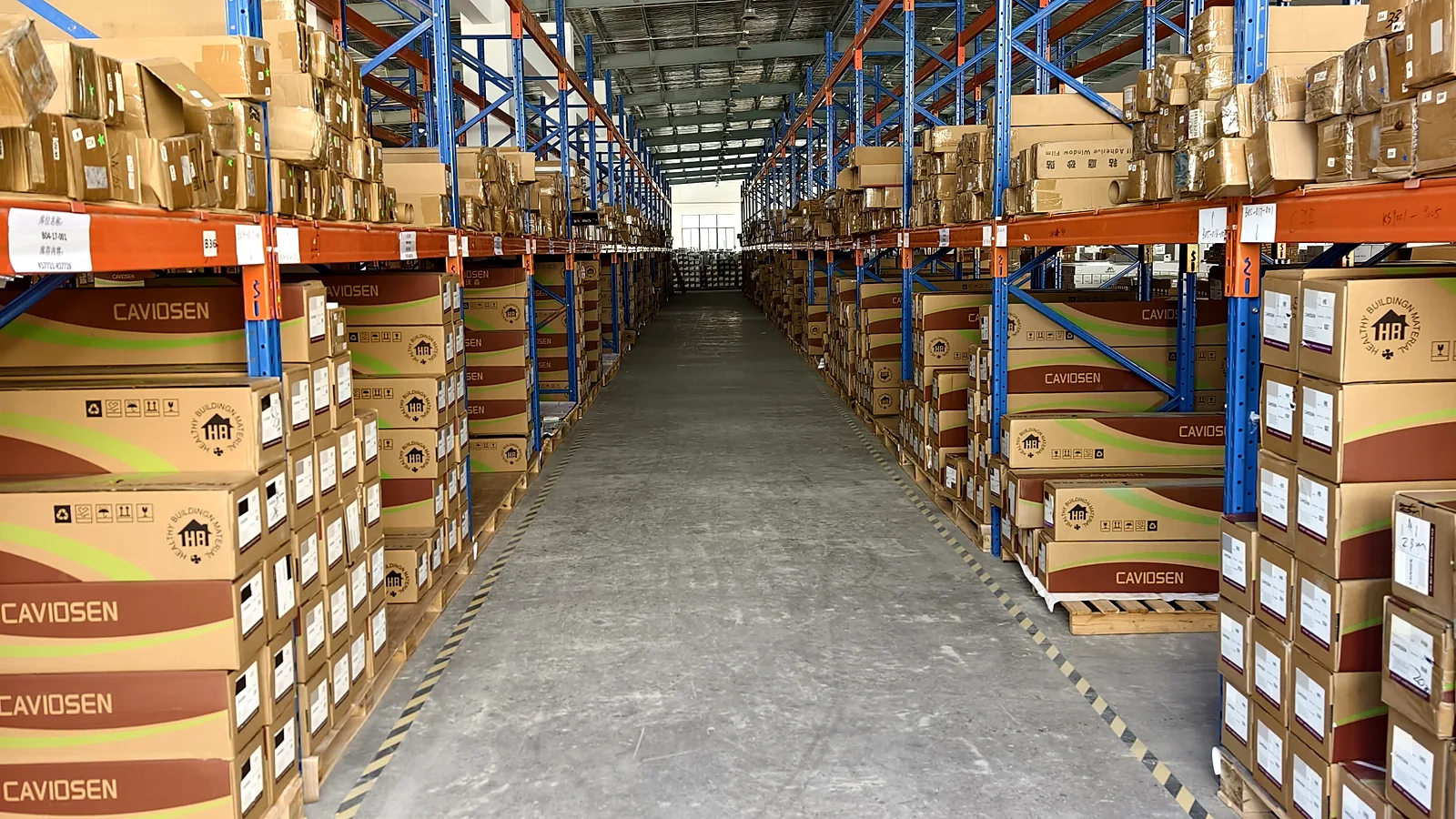 CAVIOSEN architectural interior film warehouse with organized rolls and export cartons